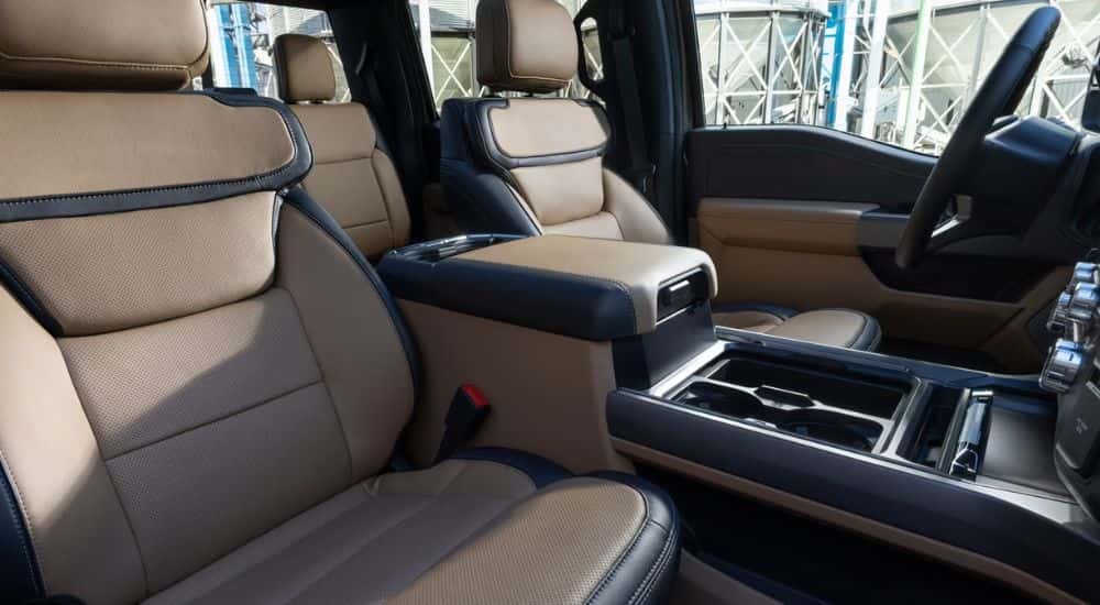 Black and tan interior of a 2026 Ford F-350 Lariat.