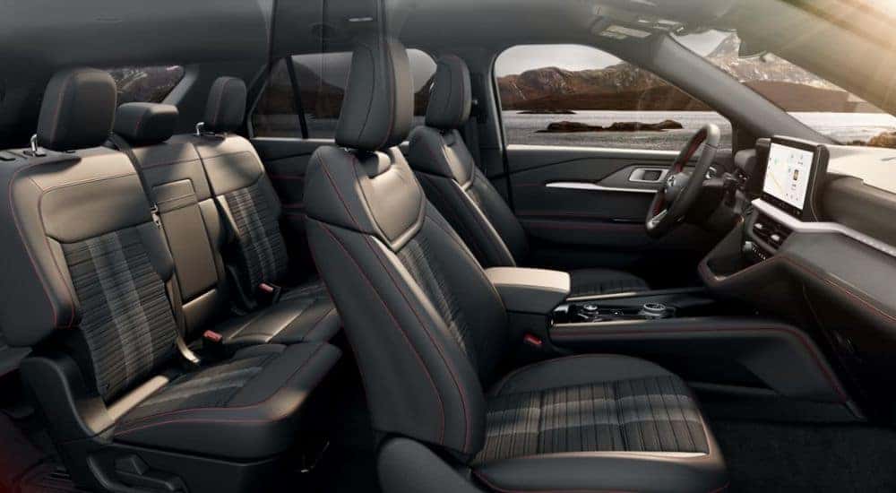 Interior view of a 2026 Ford Explorer parked by a lake.