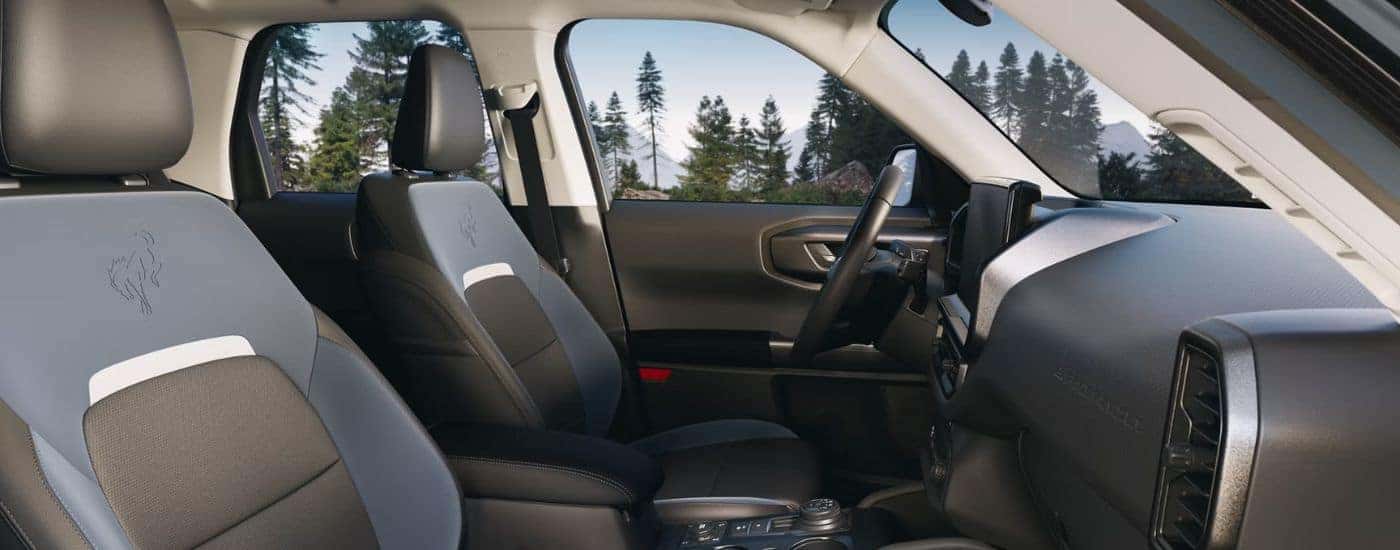 2026 Ford Bronco Sport blue and gray interior showing front seats and steering wheel.
