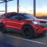 A red 2026 Ford Explorer ST driving on a bridge