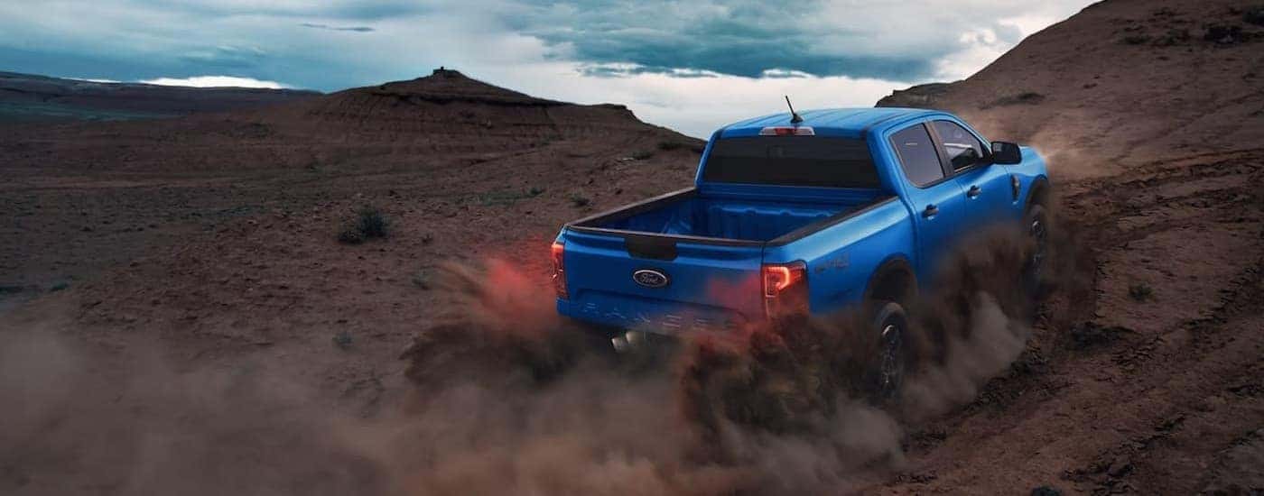 A blue 2026 Ford Ranger off-roading.