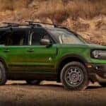 A green 2023 Ford Bronco Sport parked offroad.