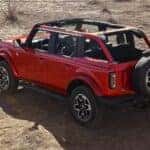 Aerial view of a red 2024 Ford Bronco parked offroad.