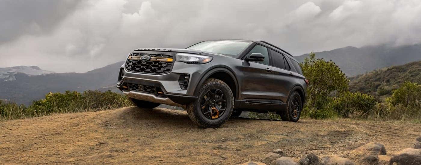 A dark gray 2026 Ford Explorer Tremor off-roading on dirt