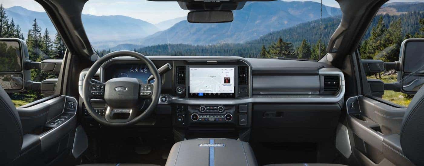 Gray interior of a Ford F-350 showing infotainment display and steering.