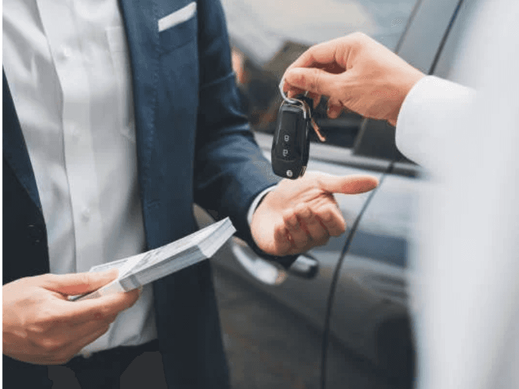 Hands switching money for keys