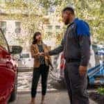 Ford service technician with a customer for a Ford recall.