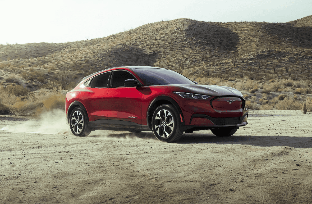 Red 2025 Mustang Mach-E in the desert.