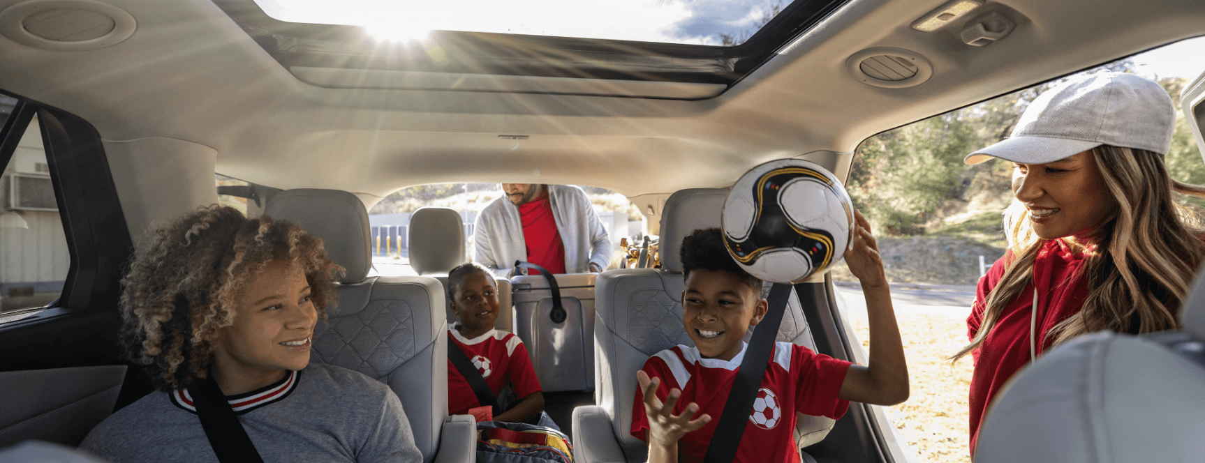 2025 Ford Explorer interior with panoramic sunroof and family.