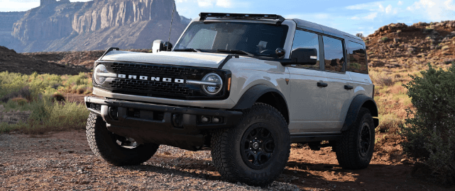 2025 Ford Bronco SUV in gray parked off-road near red rock cliffs in Cookeville, TN.