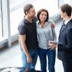 Ford dealer talking to a couple