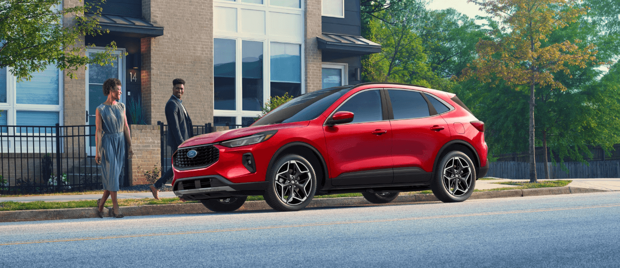 Red 2026 Ford Escape parked outside of building,