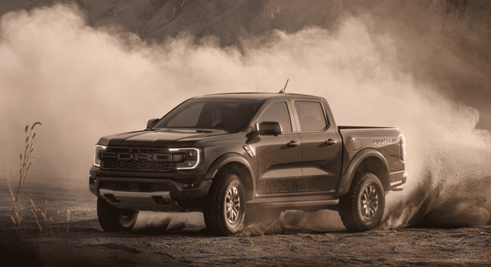 2026 Ford Ranger driving on rugged terrain.