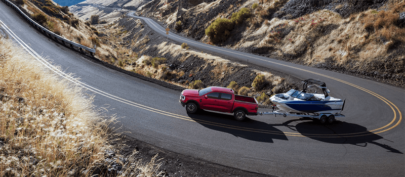 2026 Ford Ranger towing boat on road