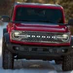 2026 Ford Bronco driving along a snow-covered path