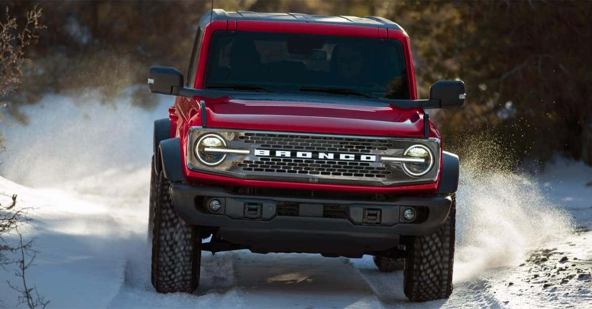 2026 Ford Bronco driving along a snow-covered path