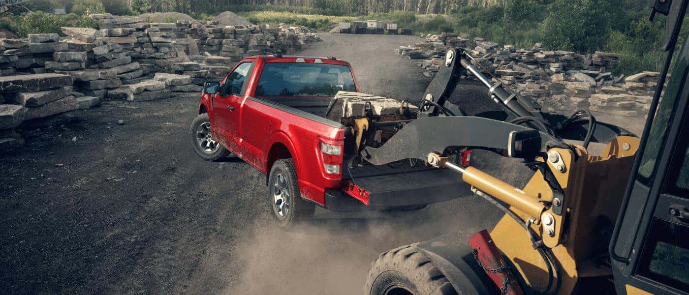 2023 Ford F-150 exterior loading rocks into bed