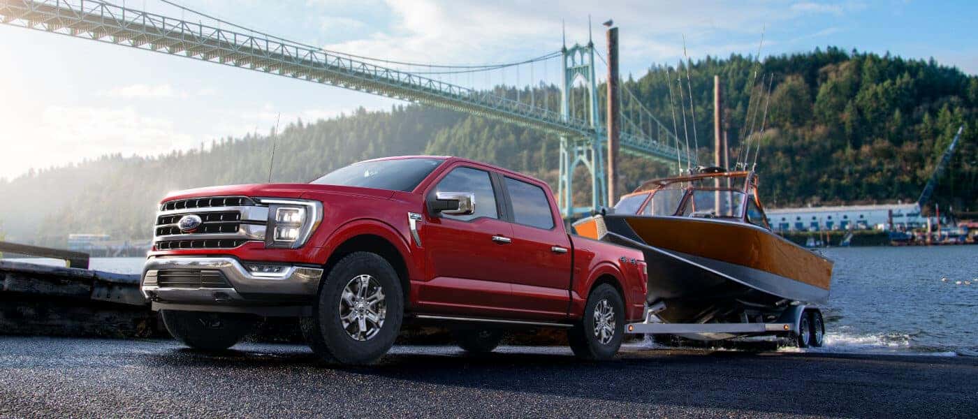2023 Ford F-150 exterior towing boat at waterfront