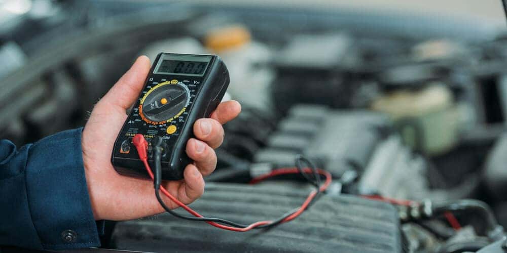 Automechanic using digital multimeter