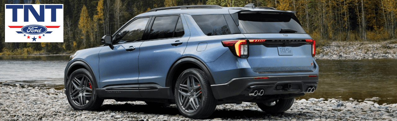 A customer test-driving a 2025 Ford Explorer at TNT Ford, showcasing the SUV's sleek design and advanced features.