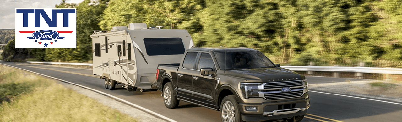 A Ford F-150 with premium accessories, tonneau cover, and off-road tires.