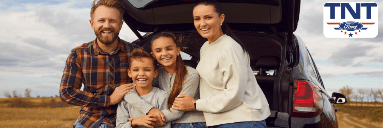A family enjoying the spacious interior of the Ford Expedition, highlighting its comfort and luxury features.