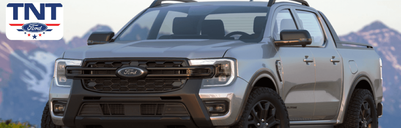A pre-owned Ford Ranger parked in front of TNT Ford dealership in Red Oak, IA
