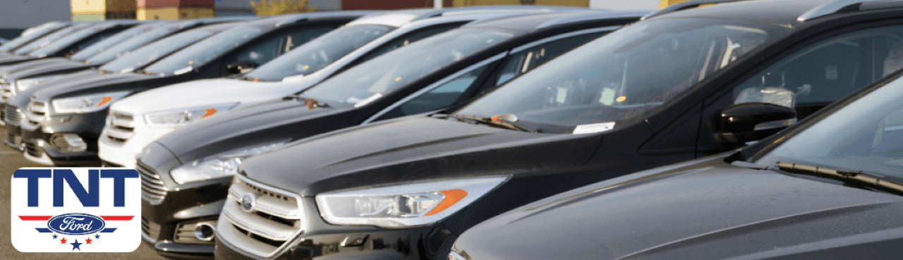 Ford vehicles lined up at TNT Ford in Red Oak, Iowa, ready for test drives near Montgomery County.