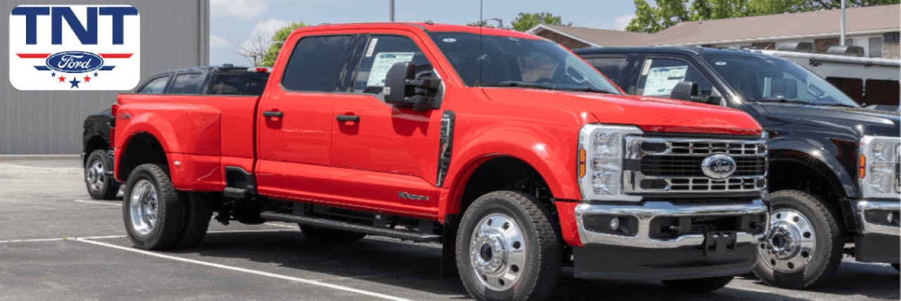 Customer inspecting a certified pre-owned vehicle at TNT Ford, a trusted car lot in Montgomery County