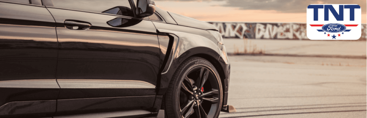 Side view of a 2020 Ford Edge parked outside TNT Ford in Montgomery County, Iowa.