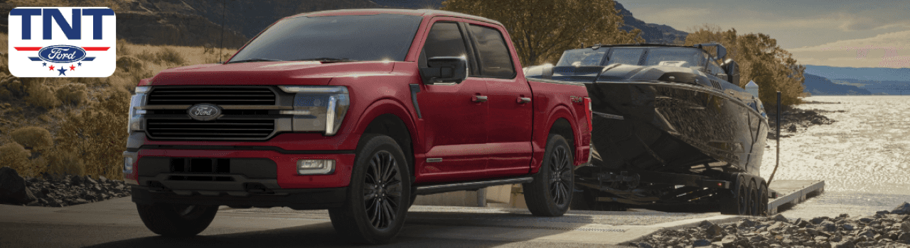 A lineup of new Ford F-150 trucks available for lease at TNT Ford in Montgomery County, Iowa