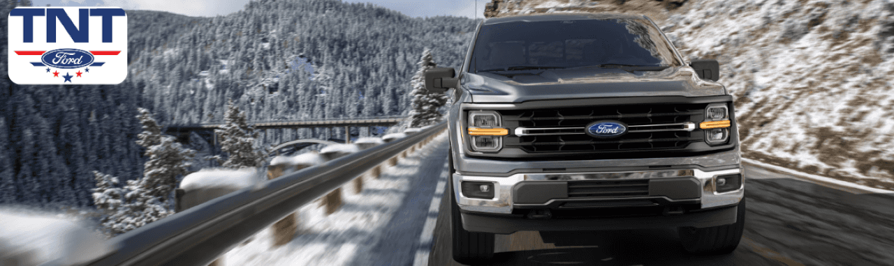 A customer test-driving a 2025 Ford F-150 near Omaha, showcasing its towing performance