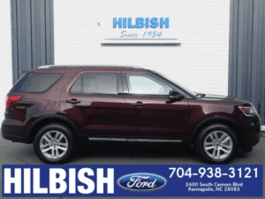 maroon ford explorer being highlighted