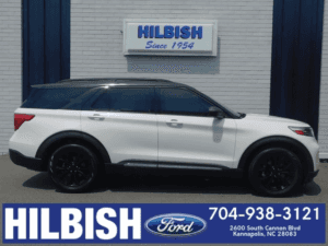white ford explorer with black rims being highlighted