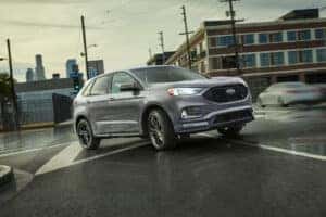 silver ford edge turning on the road