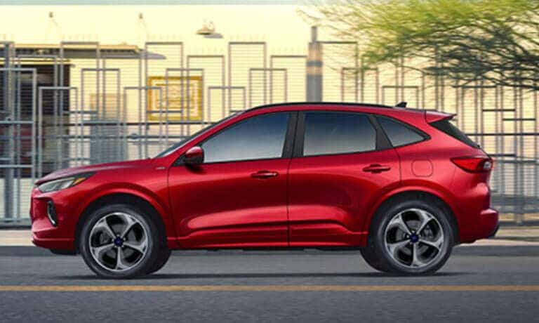 2026 Ford Escape side view by contemporary building