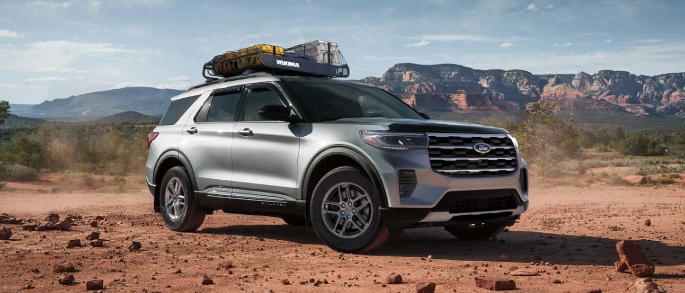 2026 Ford Explorer parked in desert with luggage