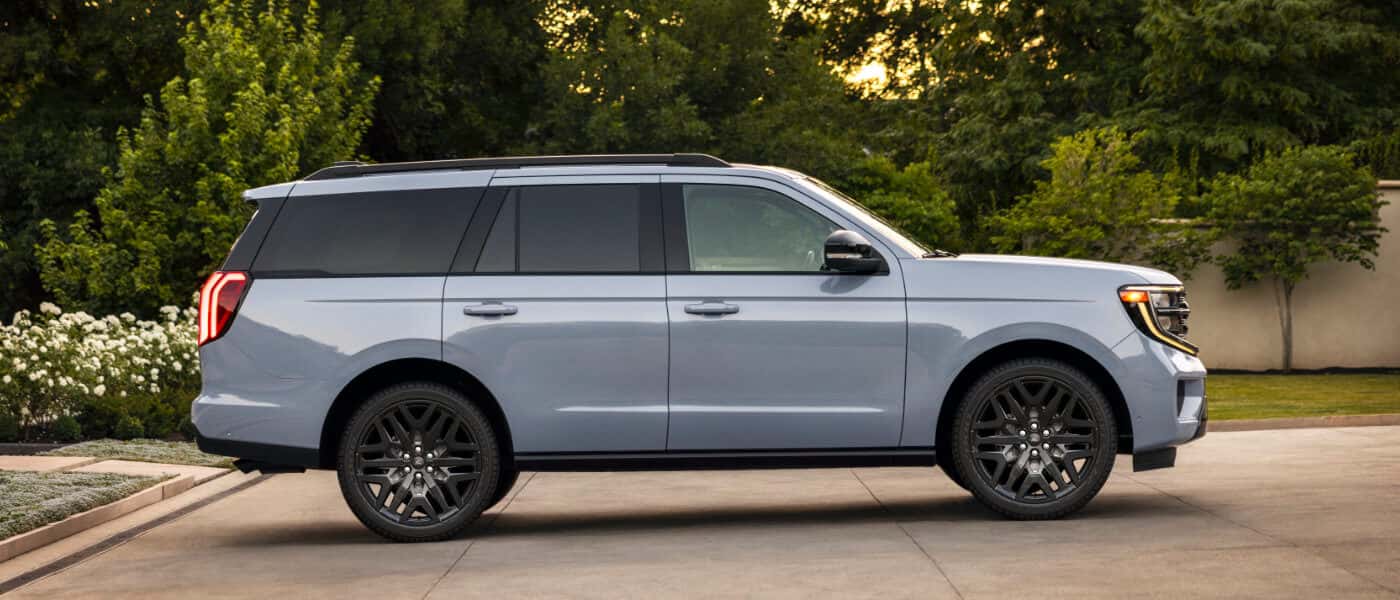 2026 Ford Expedition side view in driveway with trees