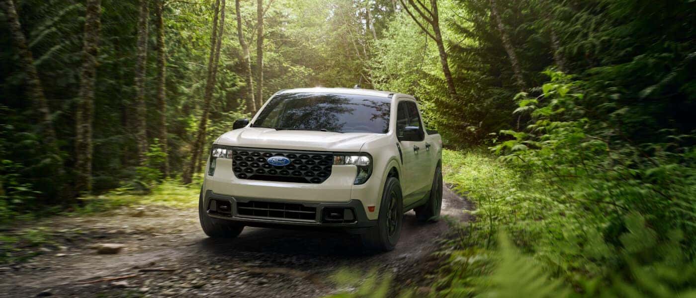 2026 Ford Maverick driving in a forest