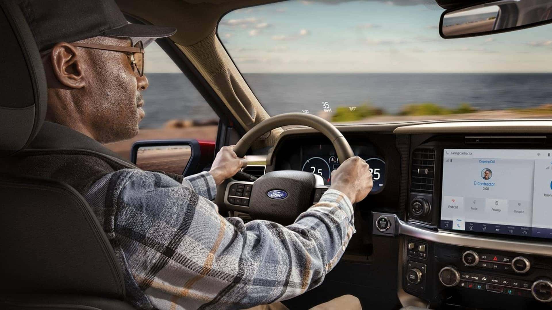 man driving f150