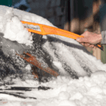 Cleaning snow off car