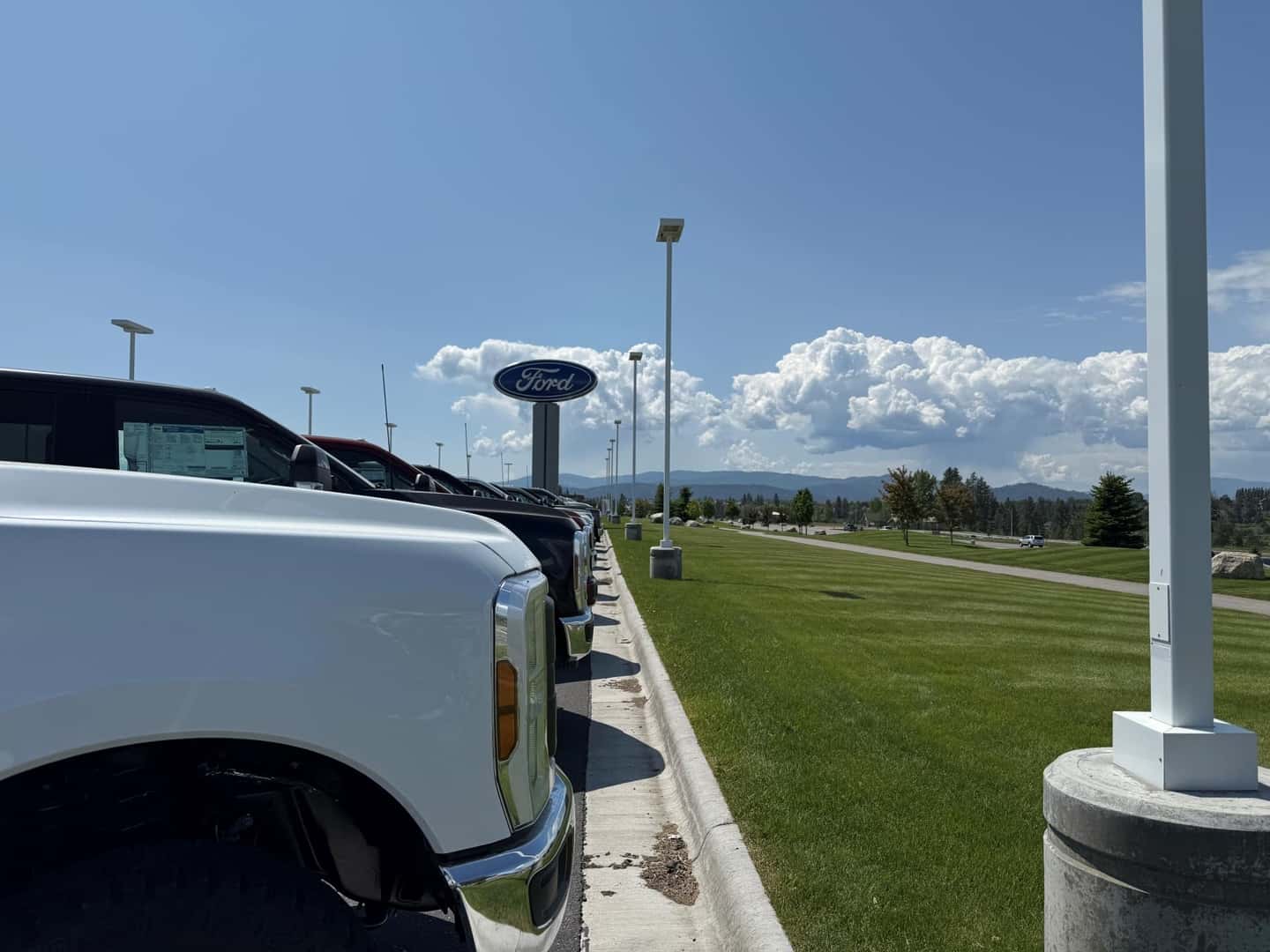 Kalispell Ford Store Sign with a row of F-350s