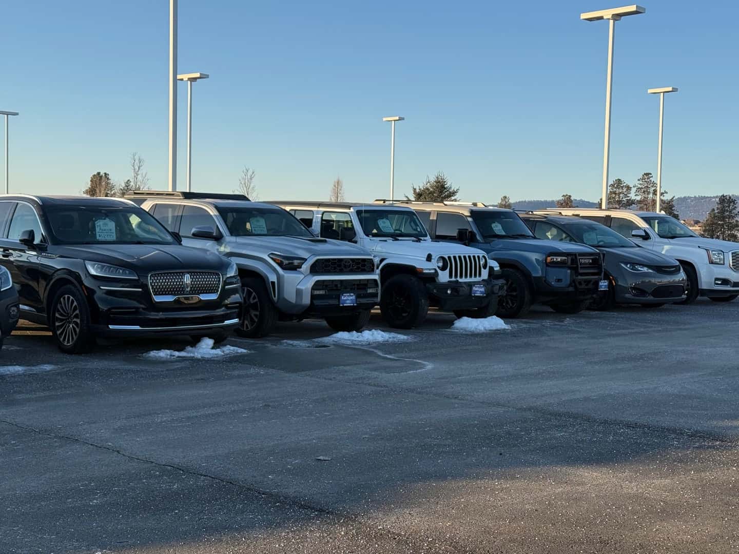 Various used vehicle brands on the Kalispell Ford lot on a chilly morning in the Flathead Valley 