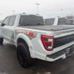 Used Ford Raptor on the Kalispell Ford lot in the Flathead Valley with a hard tonneau cover on