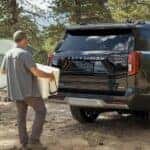 Guy loading a box into a 2026 Ford Expedition