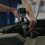 Technican at Kalispell Ford working on a vehicles engine