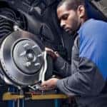 Ford certified technican working on a Ford vehicles brake assembly