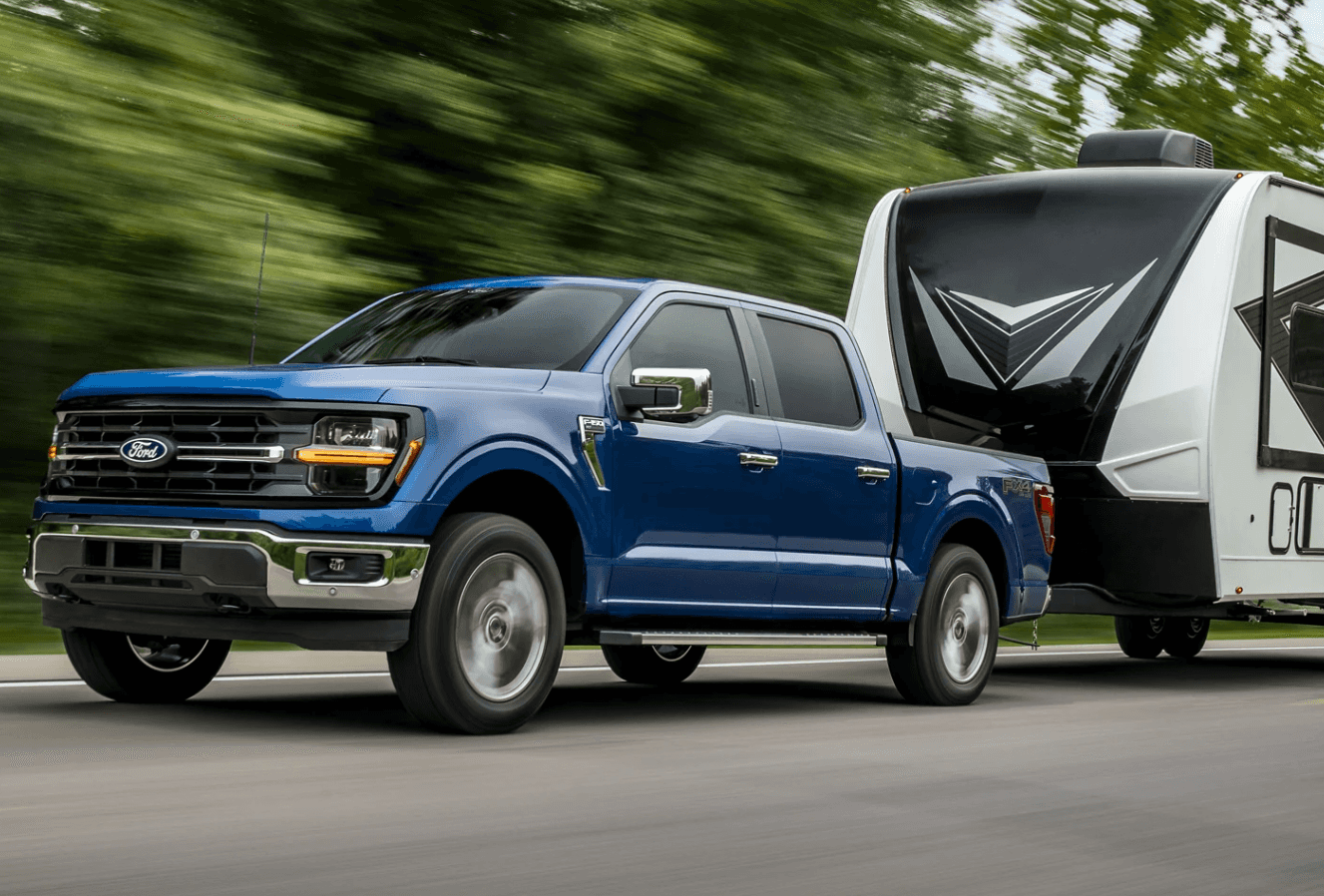 Blue 2024 Ford F-150 with Trailer in Back