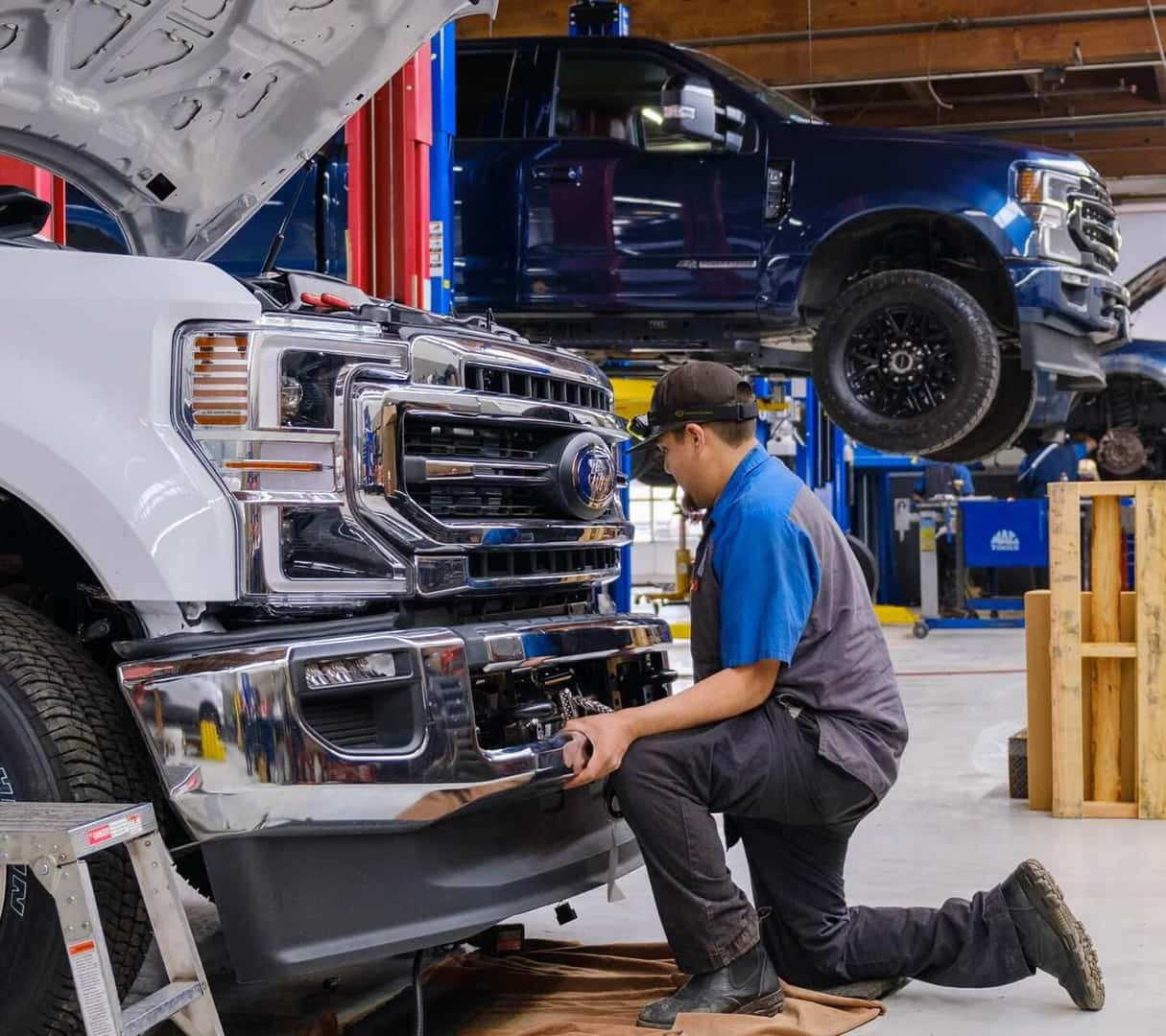 Mechanic holding a tool in the Ford Service Center