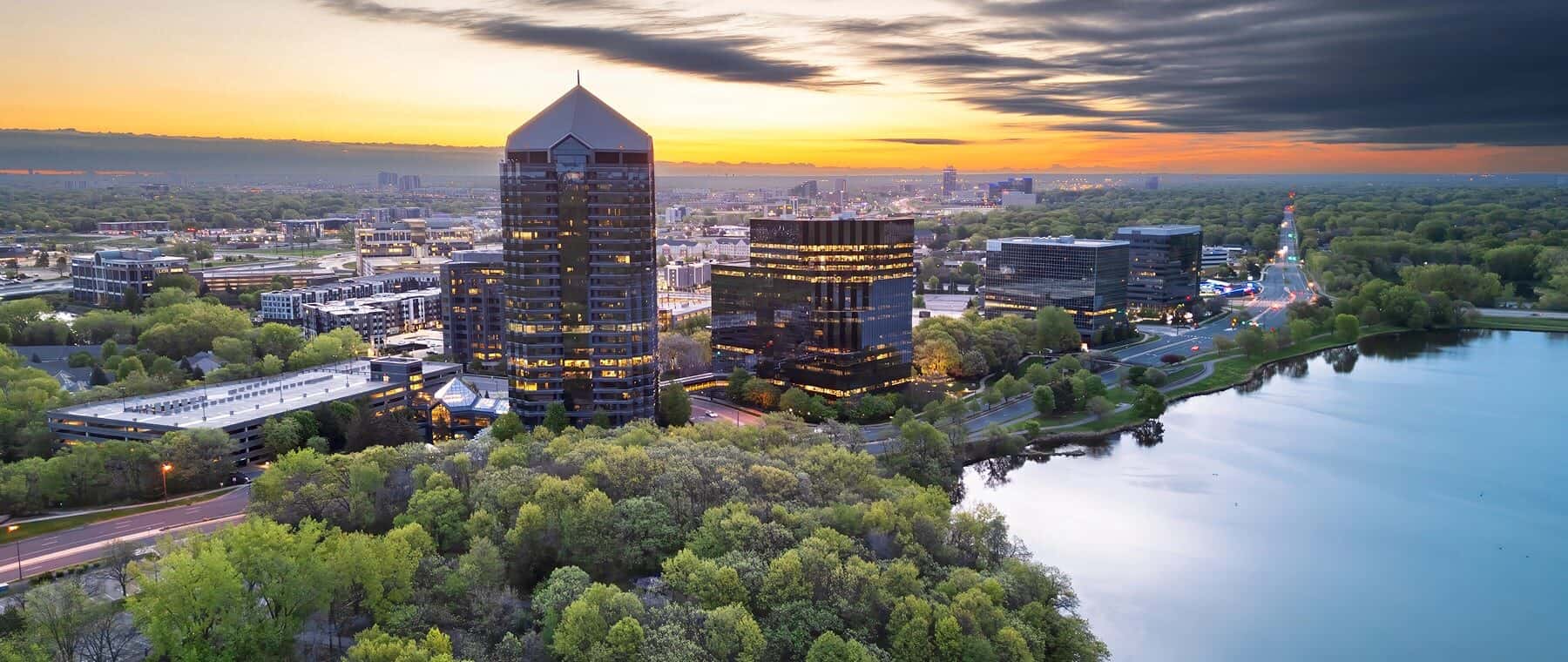 Bloomington, Minnesota, USA cityscape on Lake Normandale at dawn